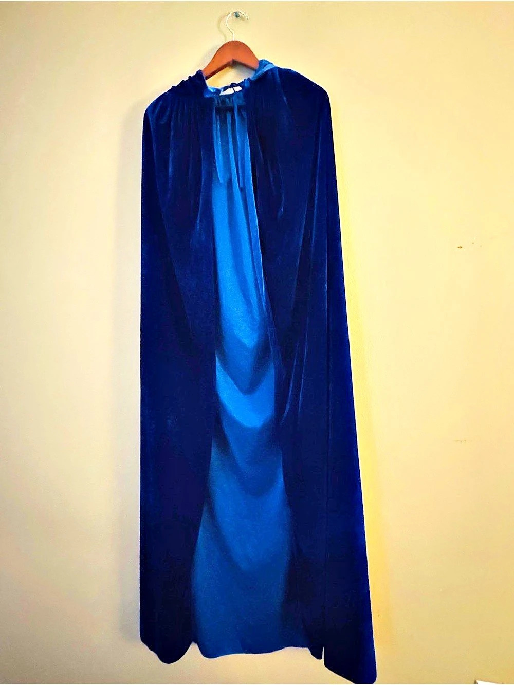 Blue Hooded cape. Excellent used condition, no visible flaws. Maybe worn once to